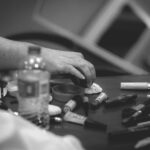 Black and white photograph taken by Chris Attig Blue Bus Photos makeup table in dressing room at Miss Gay Central Arkansas America 2023 Drag Pageant in Conway, Arkansas.
