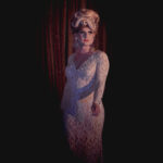 Color photograph taken by Chris Attig Blue Bus Photos showing Arkansas Drag Queen Chanel Heffington performing in her evening gown during the talent portion of the 2023 Miss Gay Central Arkansas America Drag Pageant in Conway, Arkansas.