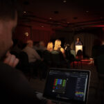 Color photograph showing view of drag pageant from view of light board.