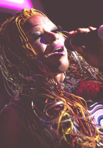 closeup up portrait sytle color image of Little Rock Arkansas Drag Queen Envy S. Heart performing at Diamonds and Pearls at Club Sway while dancing