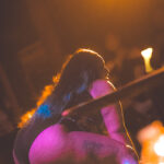 color image of of Little Rock Arkansas Drag Queen Moan A Lott performing at Diamonds and Pearls at Club Sway while grinding out a dance