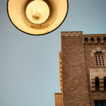 street lamp against the backdrop of a yellow brick building in downtown little rock taken by Gynger a queer photographer from Little Rock Arkansas