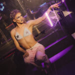 Image of Drag Artist Pagan Holiday appearing to shoot purple light from her fingertips like a lightning bolt taken by Little Rock Arkansas Queer Photographer Gynger