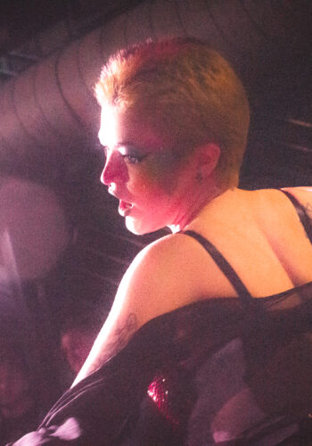 Fayetteville non binary drag artist Emerald Haze performing a number from Les Miserables "empty tables and empty chairs" mixed with "do you hear the people sing" at Taylor Madison Monroe's weekly Sunday Showcase at Club C4 in Fayetteville, Arkansas,