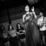 Fayetteville non binary drag artist Emerald Haze performing a number from Les Miserables "empty tables and empty chairs" mixed with "do you hear the people sing" at Taylor Madison Monroe's weekly Sunday Showcase at Club C4 in Fayetteville, Arkansas,